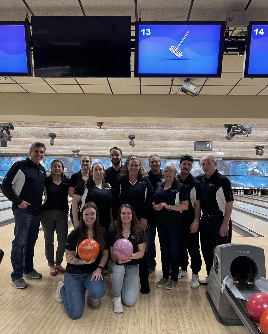 Group photo of the Wave team at the Strike for gold bowling tourament