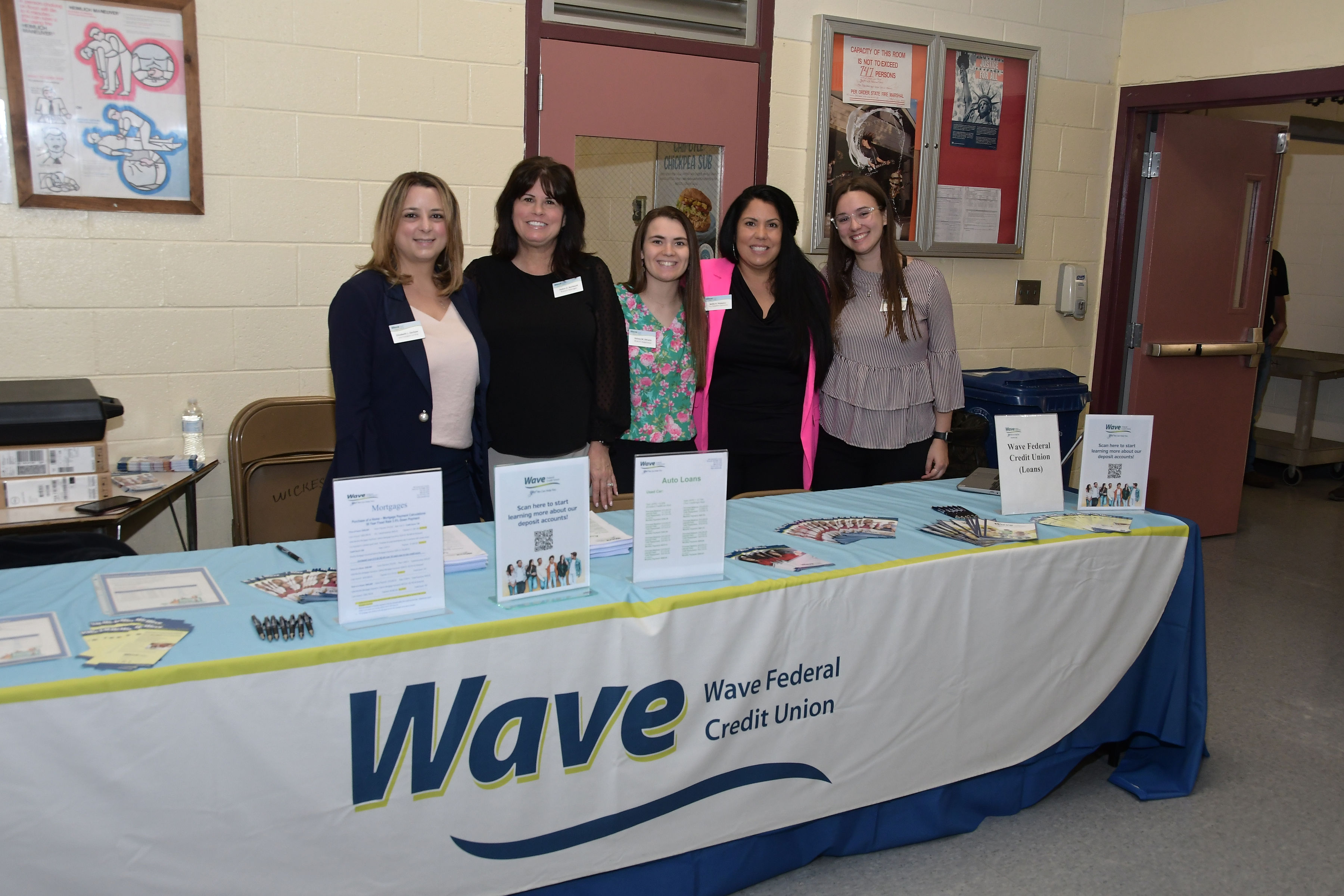 WAVE staff at their table booth